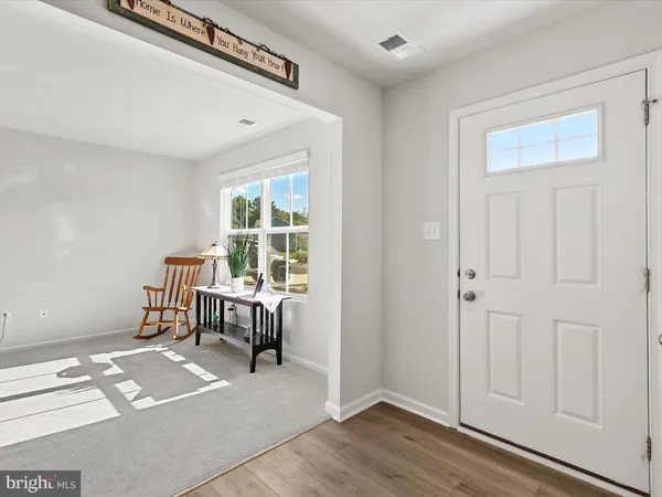 a view of livingroom with furniture and window