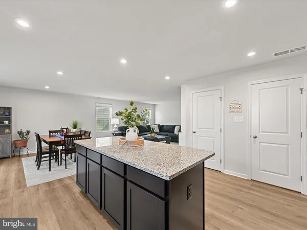 a view of a dining area with furniture and wooden floor