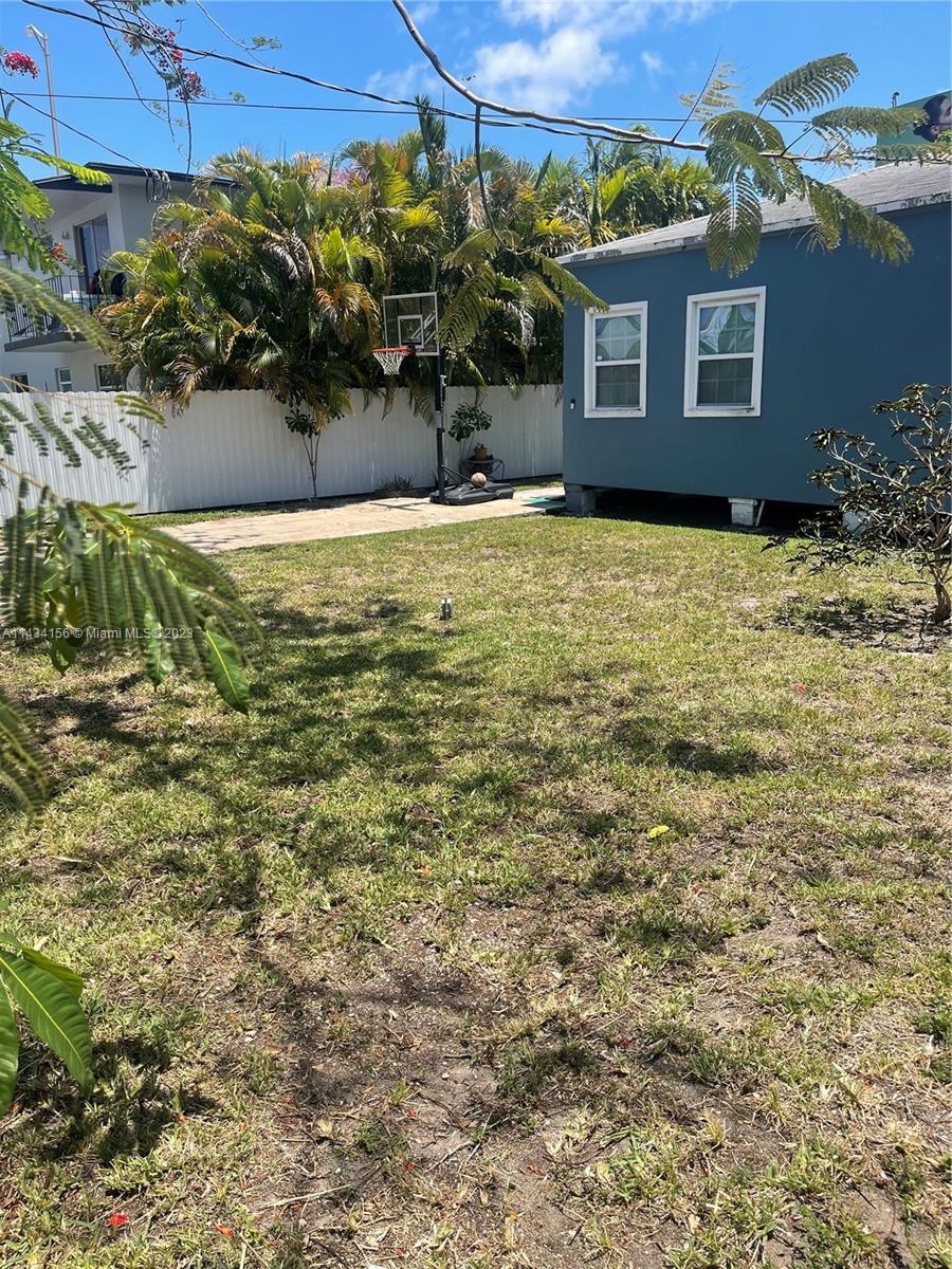 652 Northwest 28th Street Miami, FL 33127 - Photo 12 of 15 a view of a house with a yard