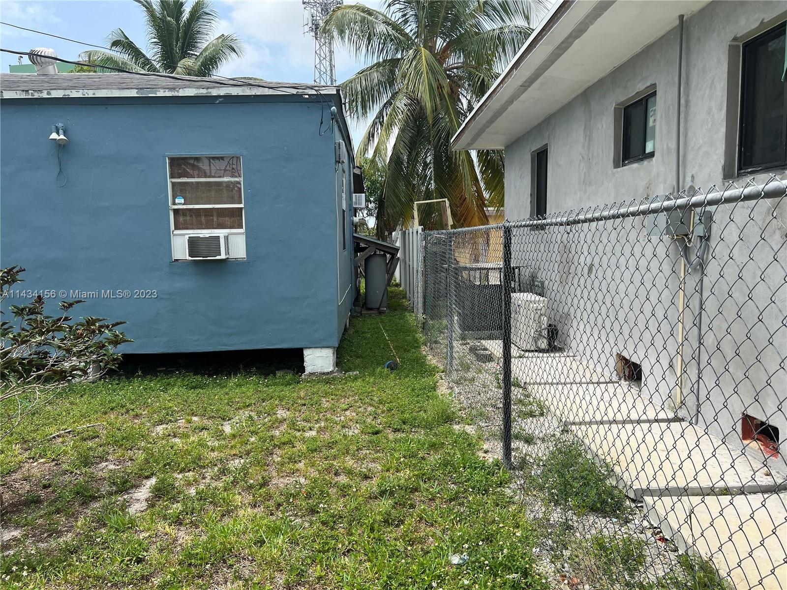 652 Northwest 28th Street Miami, FL 33127 - Photo 2 of 15 a backyard of a house with lots of green space