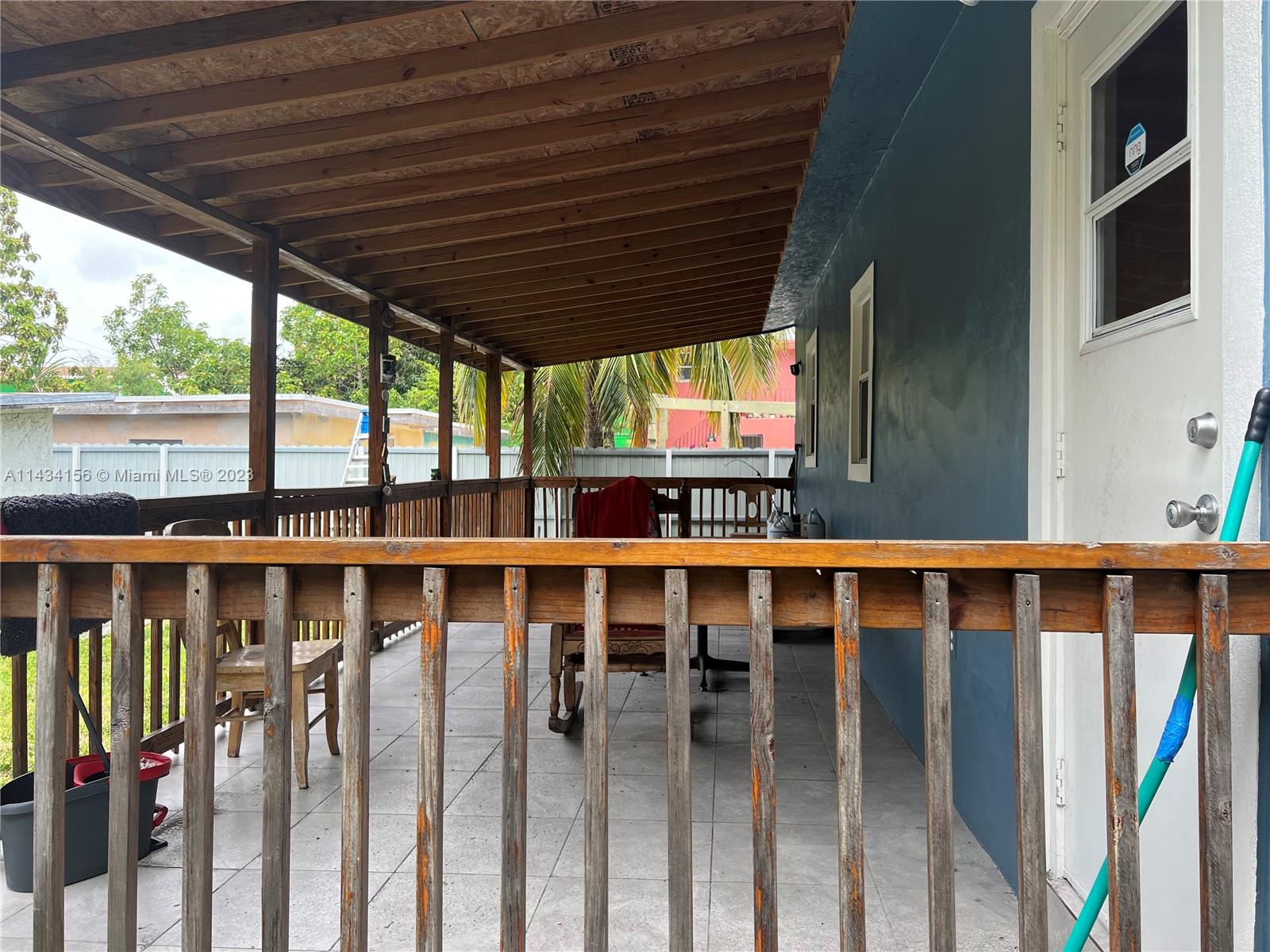 652 Northwest 28th Street Miami, FL 33127 - Photo 4 of 15 a view of a small deck with wooden floor and outdoor space