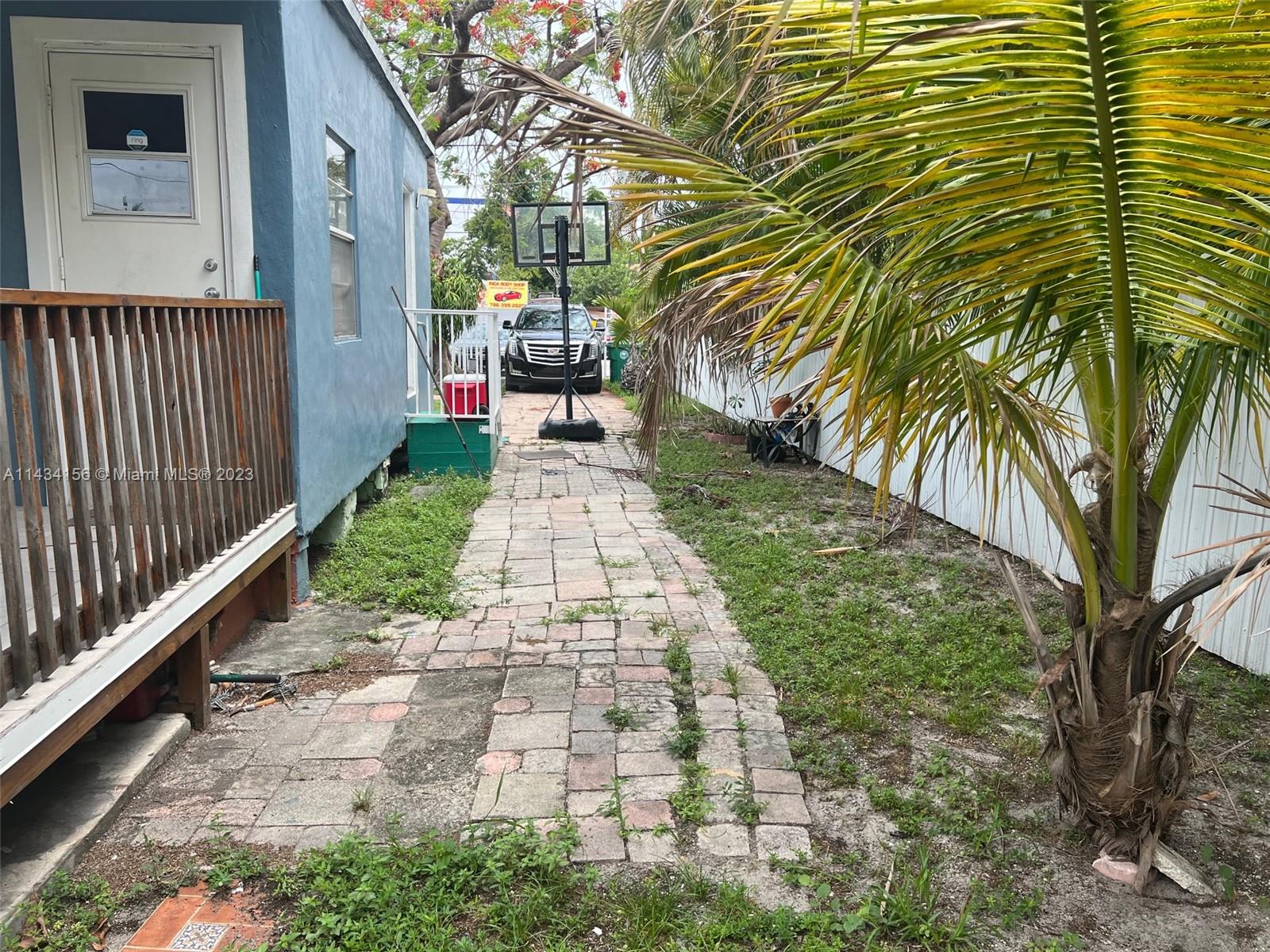 652 Northwest 28th Street Miami, FL 33127 - Photo 7 of 15 a view of a pathway with a backyard
