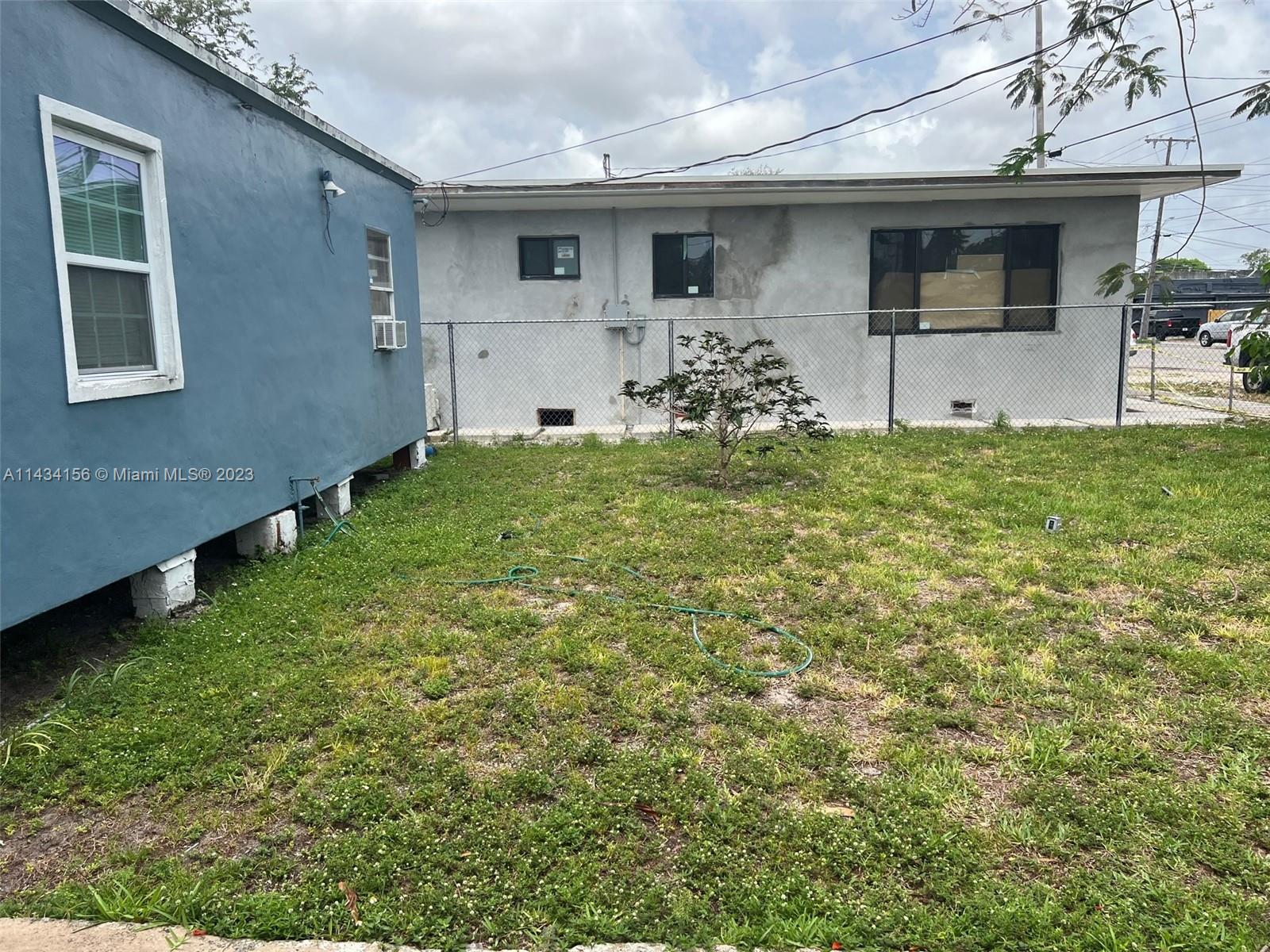 652 Northwest 28th Street Miami, FL 33127 - Photo 8 of 15 a front view of a house with garden