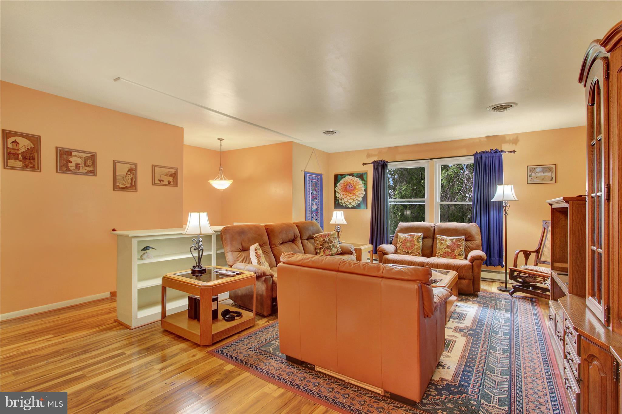 LIVING ROOM WITH BOOKCASE.