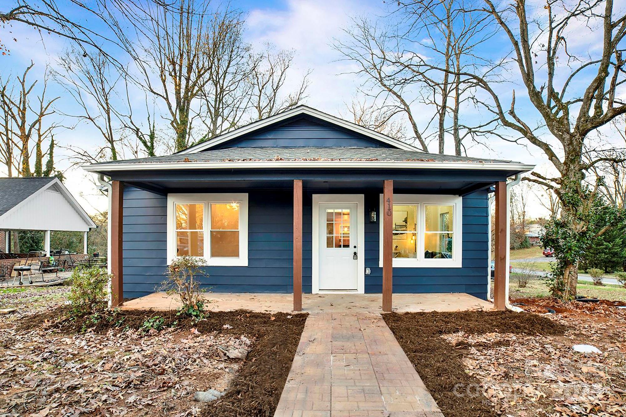 410 24th Street Southwest Hickory, NC 28602 - Photo 1 of 41 a front view of a house with a yard