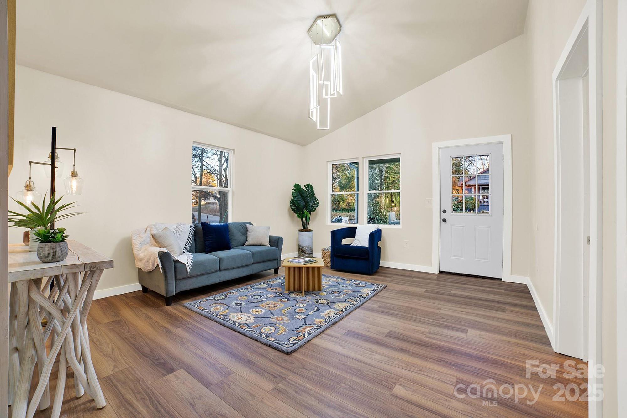 410 24th Street Southwest Hickory, NC 28602 - Photo 11 of 41 a living room with furniture and wooden floor