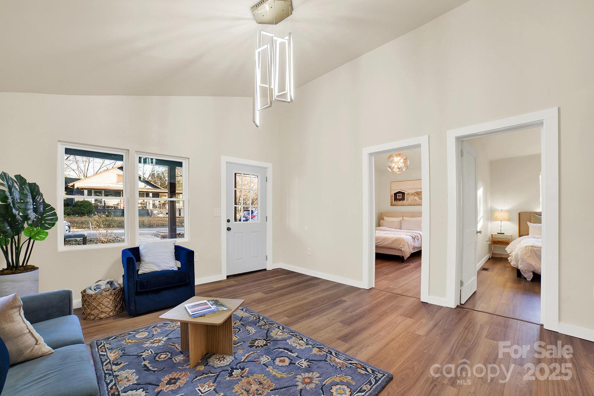410 24th Street Southwest Hickory, NC 28602 - Photo 13 of 41 a living room with furniture and a wooden floor