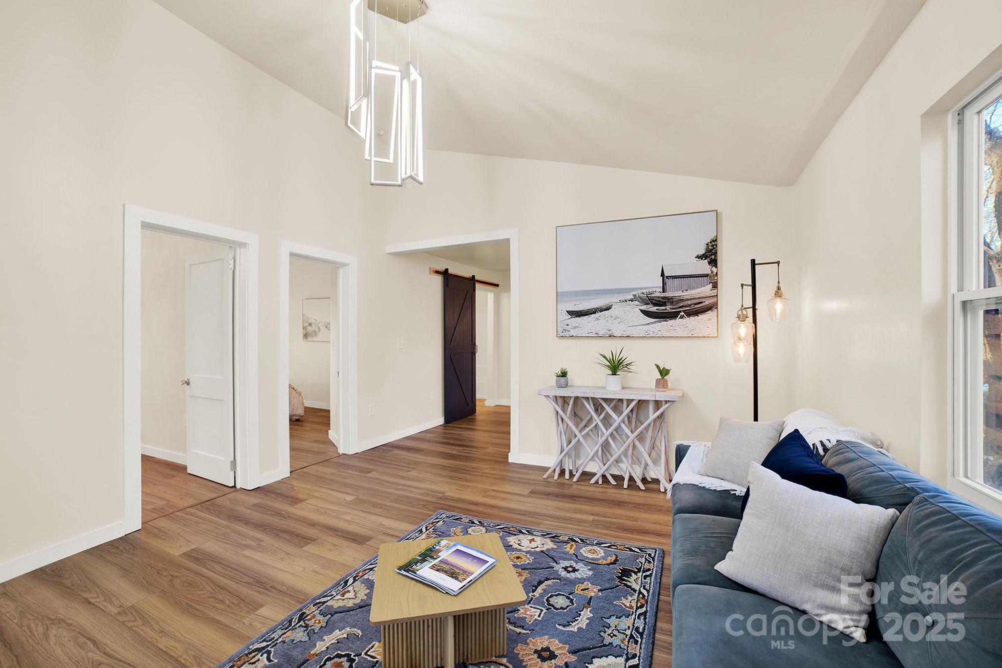410 24th Street Southwest Hickory, NC 28602 - Photo 14 of 41 a living room with furniture and wooden floor