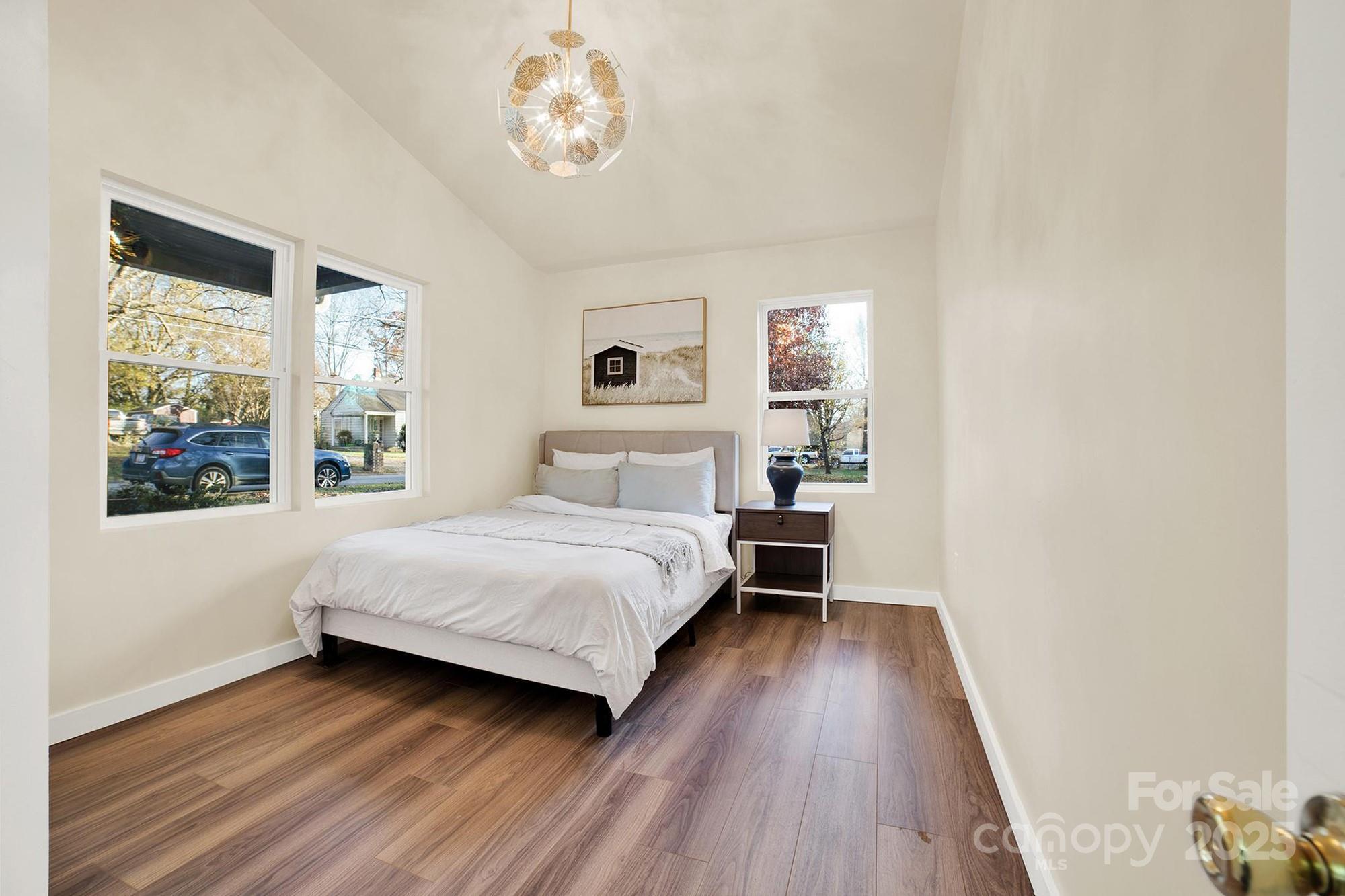 410 24th Street Southwest Hickory, NC 28602 - Photo 15 of 41 a bedroom with a large bed and a large window