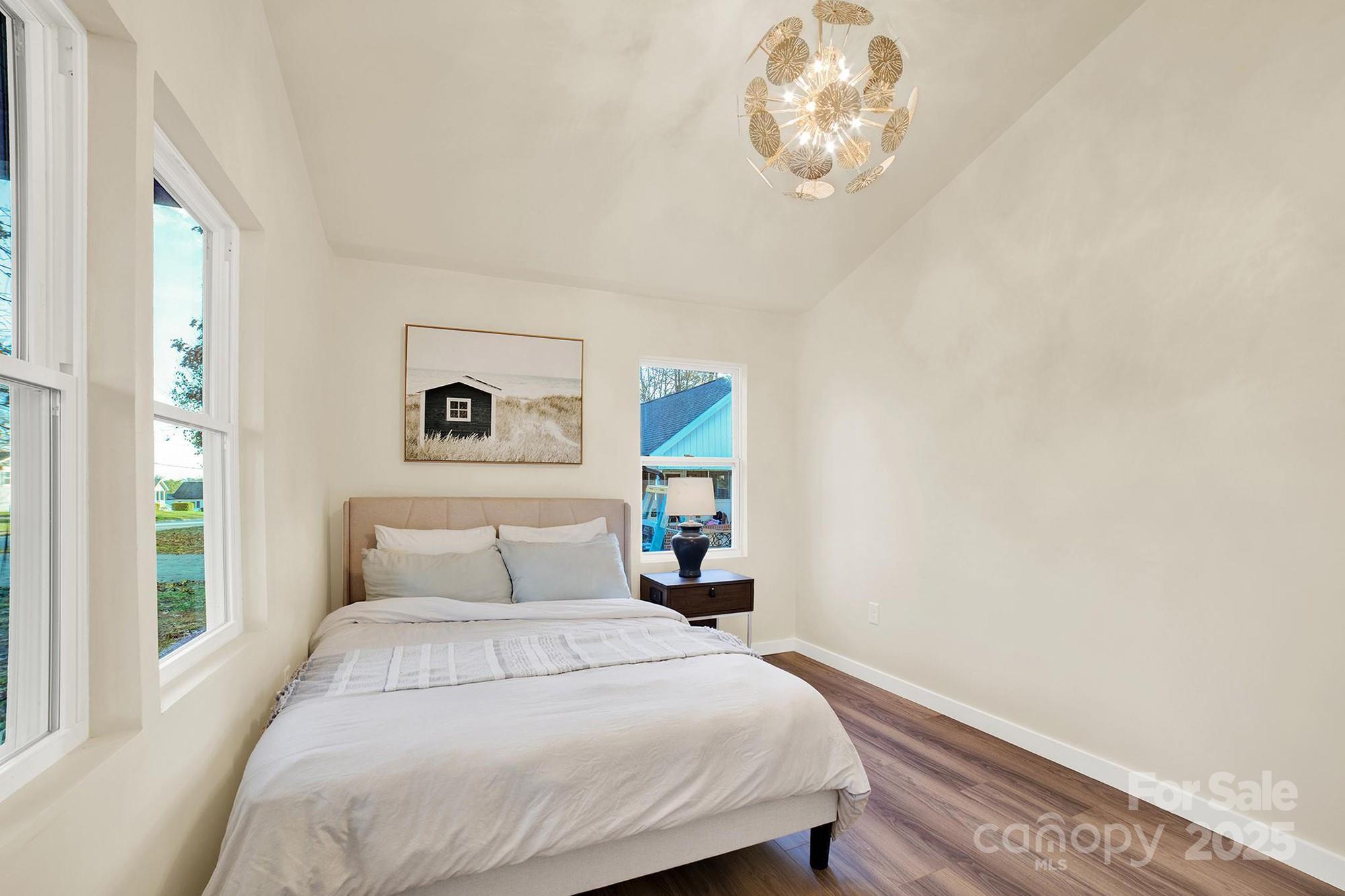 410 24th Street Southwest Hickory, NC 28602 - Photo 17 of 41 a bedroom with a bed and a window