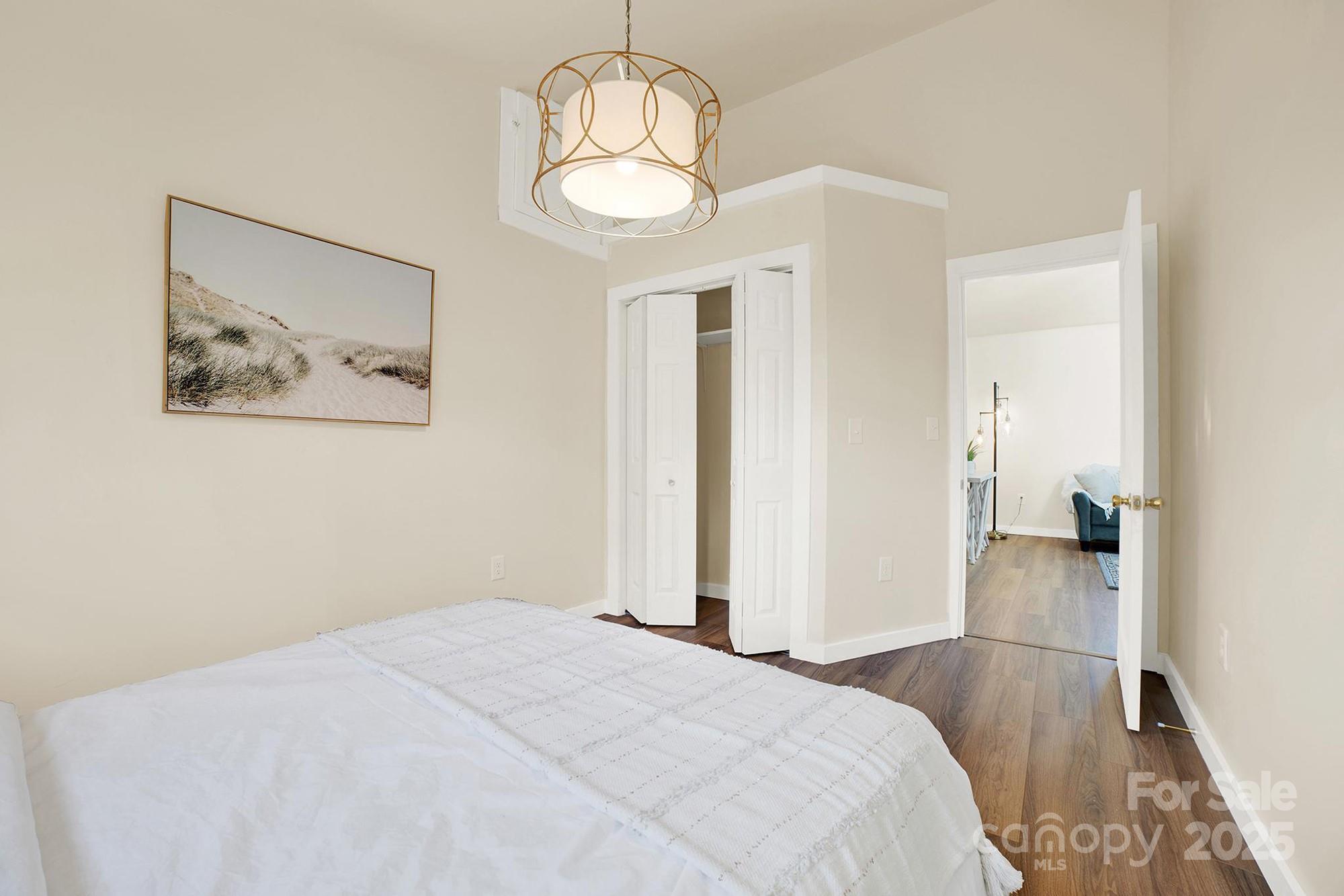 410 24th Street Southwest Hickory, NC 28602 - Photo 21 of 41 a bedroom with bed and wooden floor