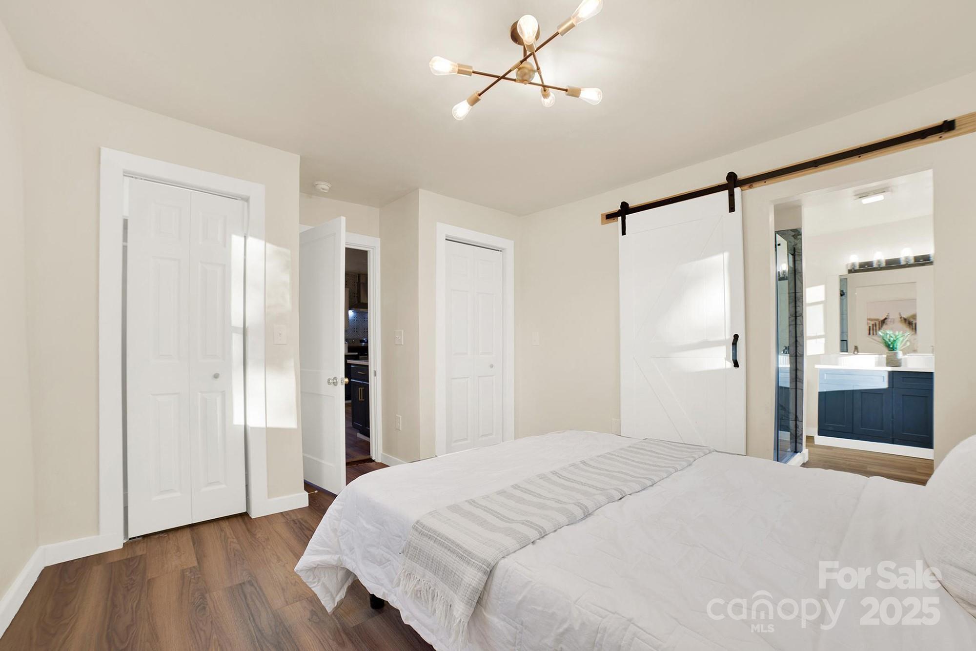 410 24th Street Southwest Hickory, NC 28602 - Photo 31 of 41 a bedroom with a bed and a dresser