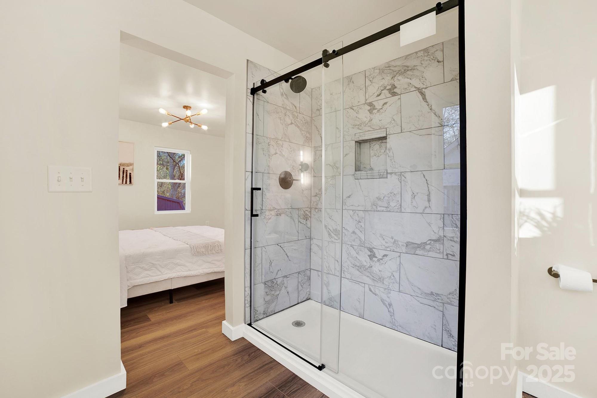 410 24th Street Southwest Hickory, NC 28602 - Photo 34 of 41 a bathroom with a bathtub and a shower