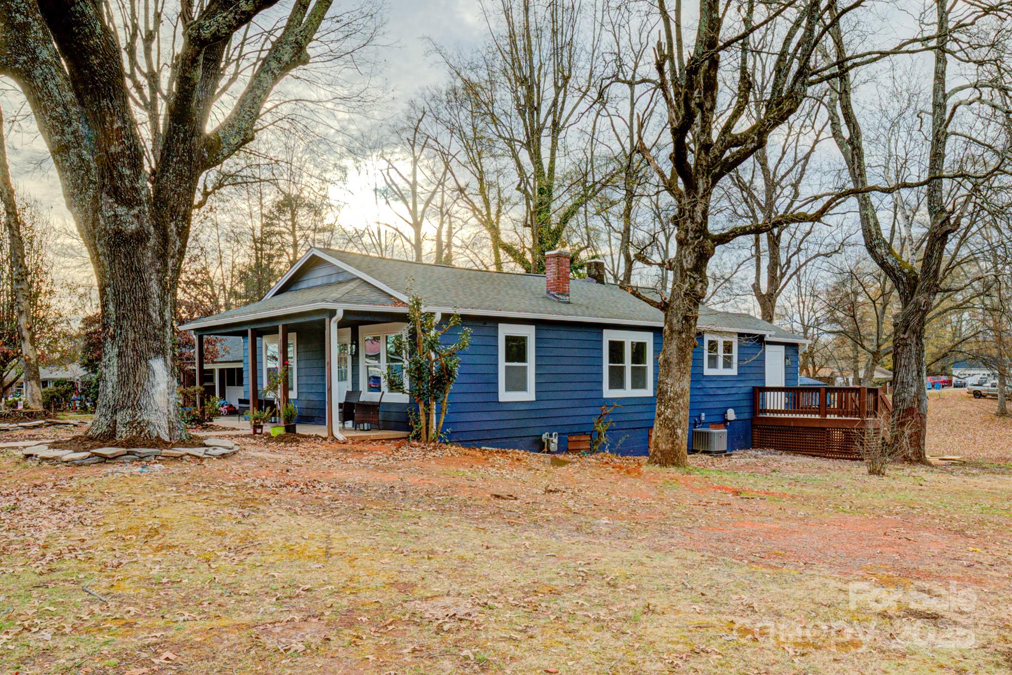 410 24th Street Southwest Hickory, NC 28602 - Photo 36 of 41 a front view of a house with a yard covered in snow