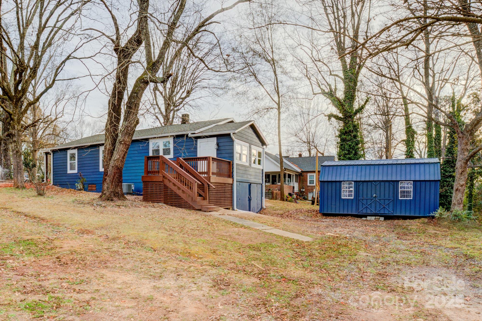 410 24th Street Southwest Hickory, NC 28602 - Photo 39 of 41 a view of a house with a yard covered in snow