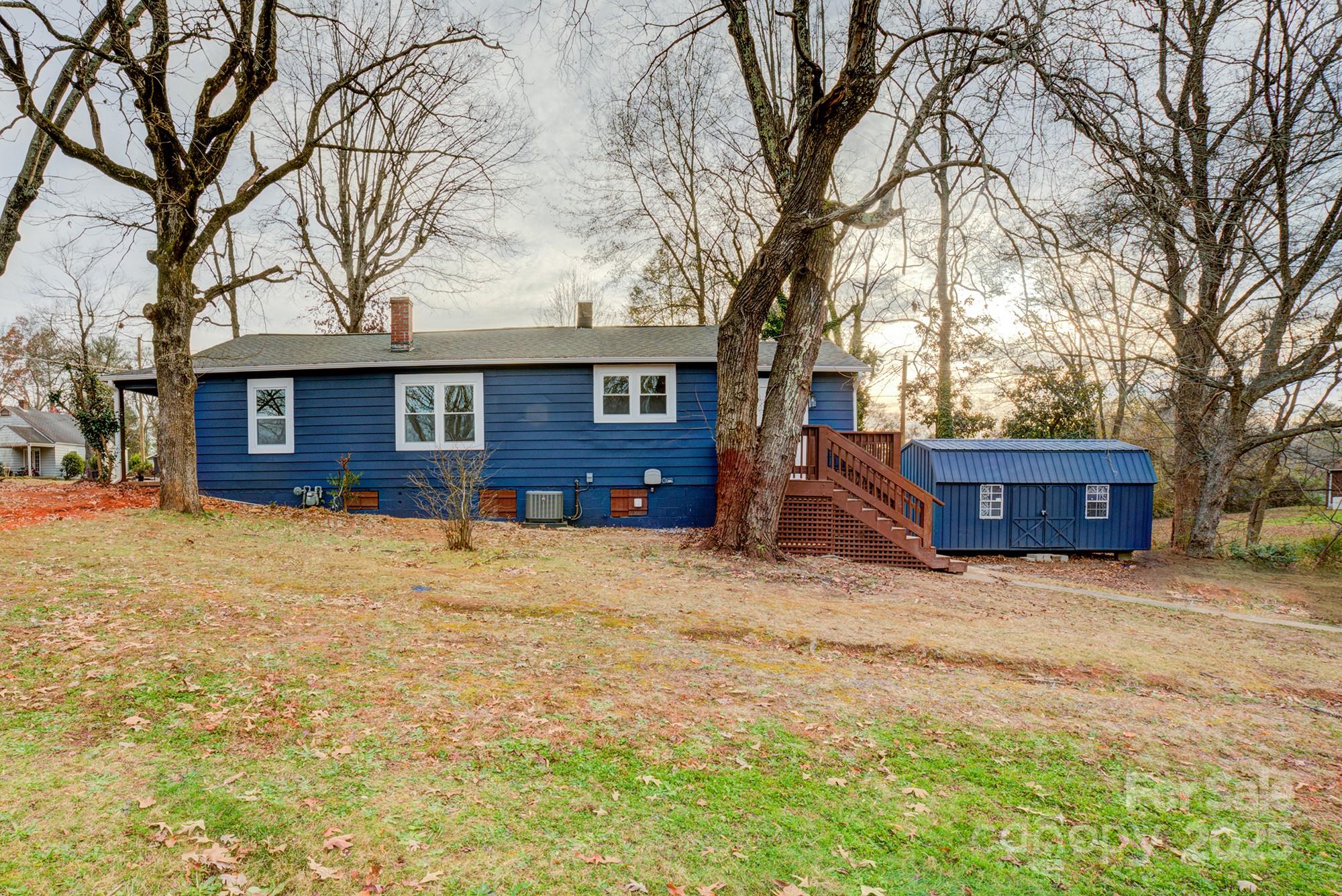 410 24th Street Southwest Hickory, NC 28602 - Photo 40 of 41 a front view of a house with a yard covered in snow