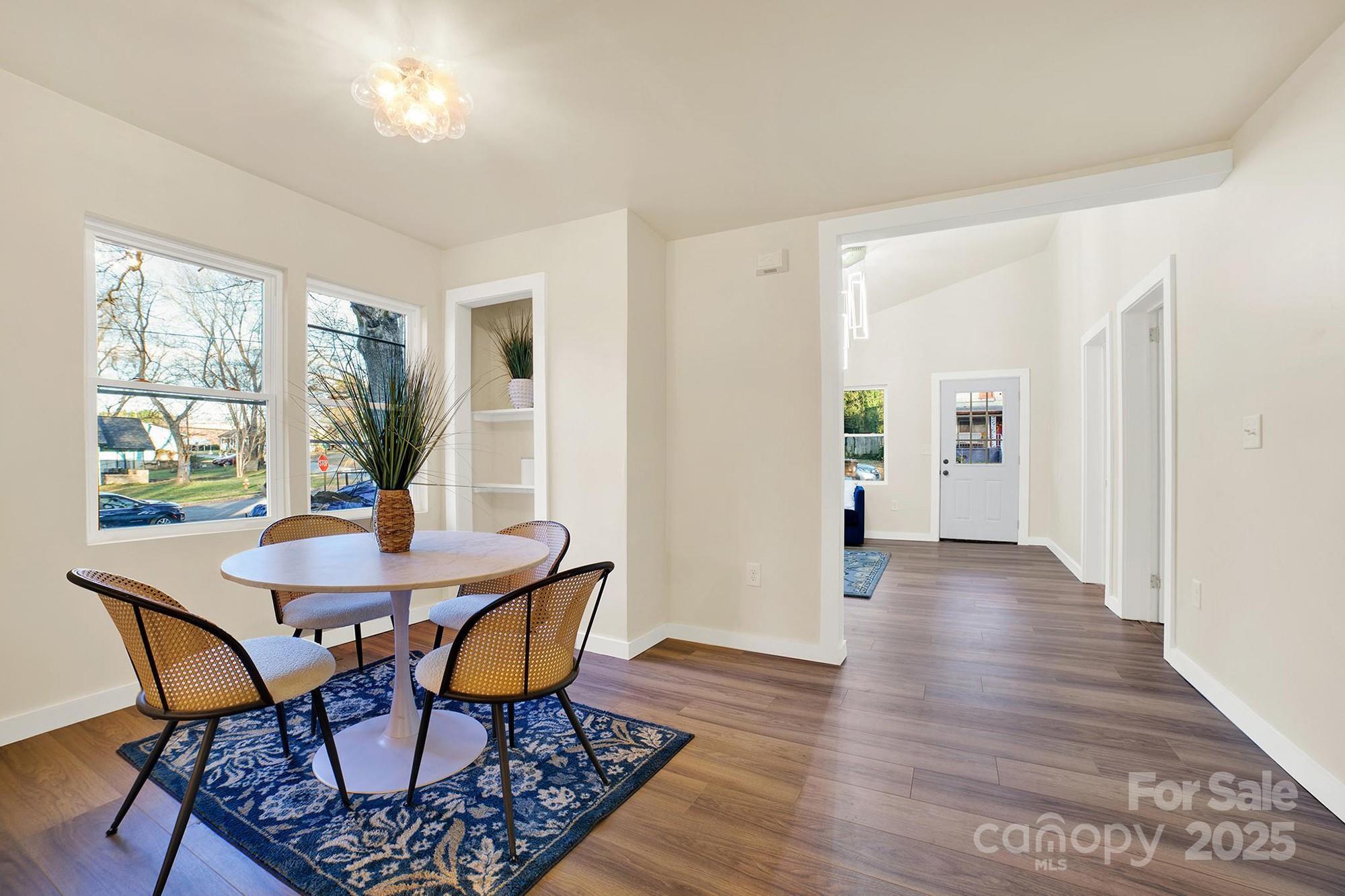 410 24th Street Southwest Hickory, NC 28602 - Photo 9 of 41 a view of a dining room with furniture window and wooden floor