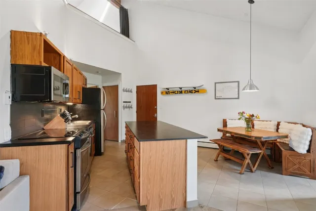 a kitchen with a table and chairs