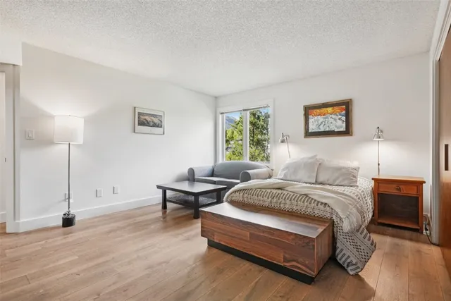 a bedroom with a bed and a couch