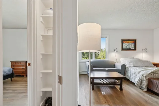 a bedroom with a bed and a couch