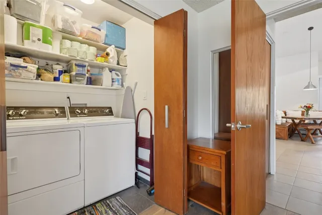 a kitchen with stainless steel appliances granite countertop a refrigerator and a stove
