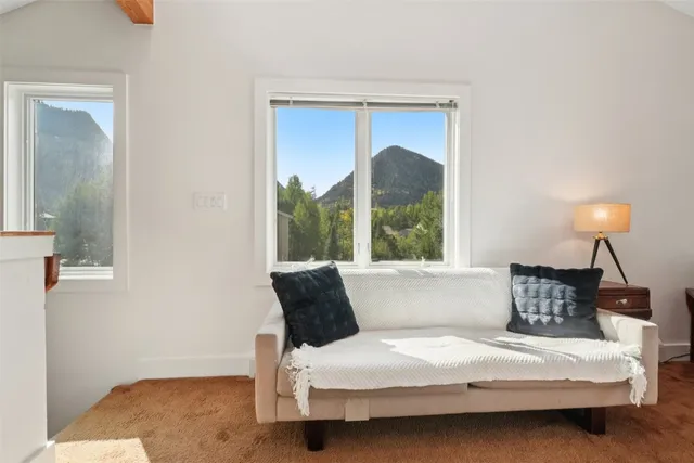 a bedroom with a bed and a mirror