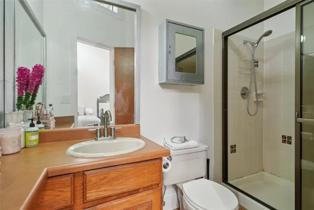 a view of road with card parked on side and road