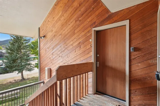 a view of balcony with wooden floor and seating space