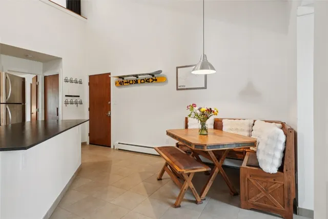 a dining room with furniture and window