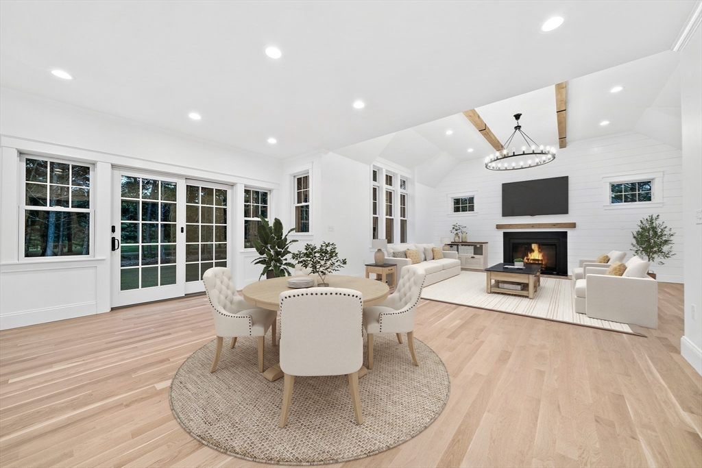 342 Country Club Way Kingston, MA 02364 - Photo 12 of 22 a living room with furniture fireplace and a large window