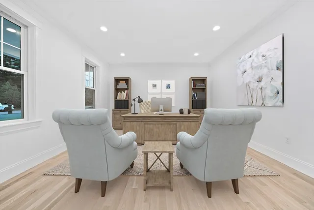 an aerial view of a house with a yard