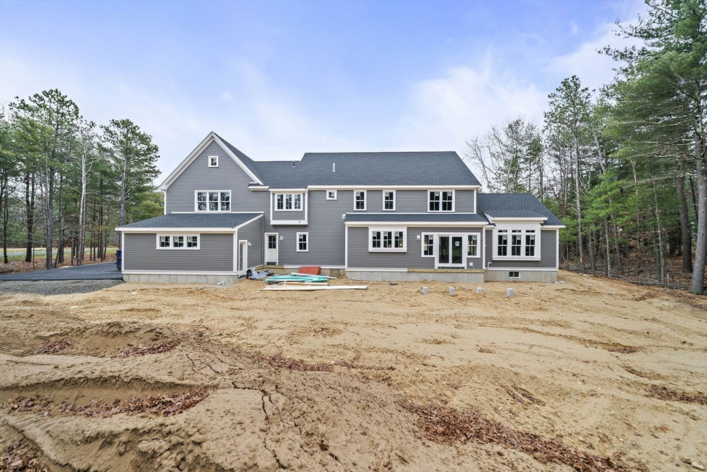 342 Country Club Way Kingston, MA 02364 - Photo 2 of 22 a front view of a house with a yard