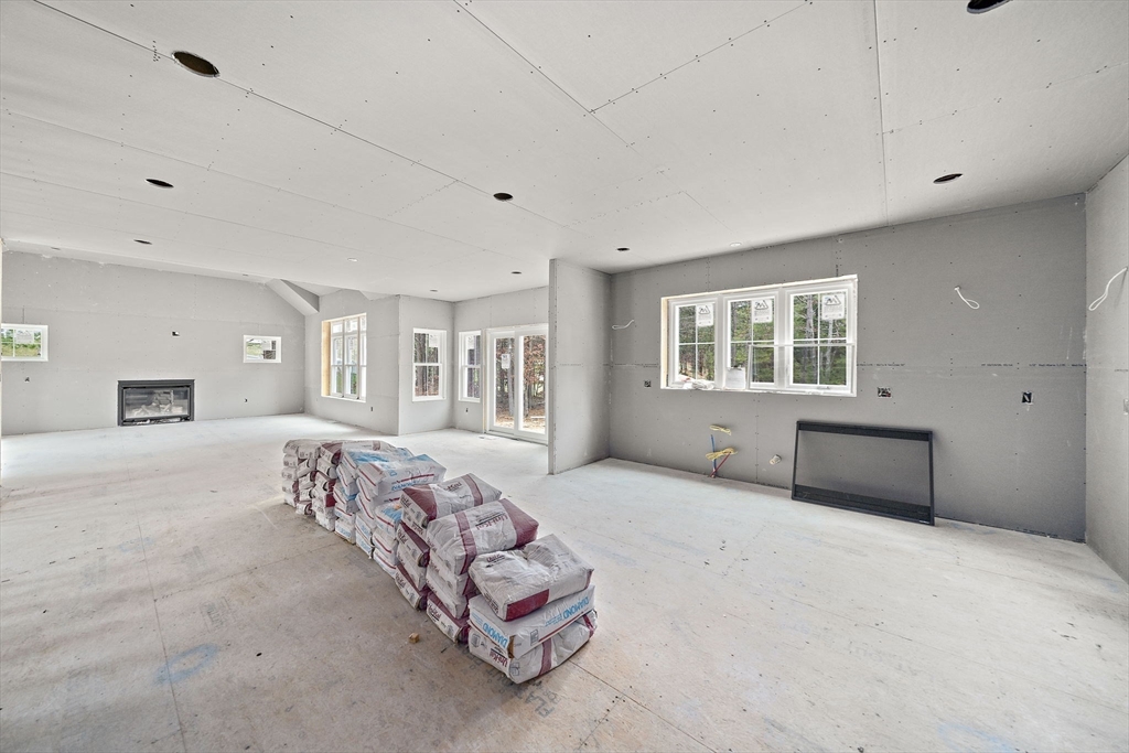 342 Country Club Way Kingston, MA 02364 - Photo 4 of 22 a bedroom with a bed and a window