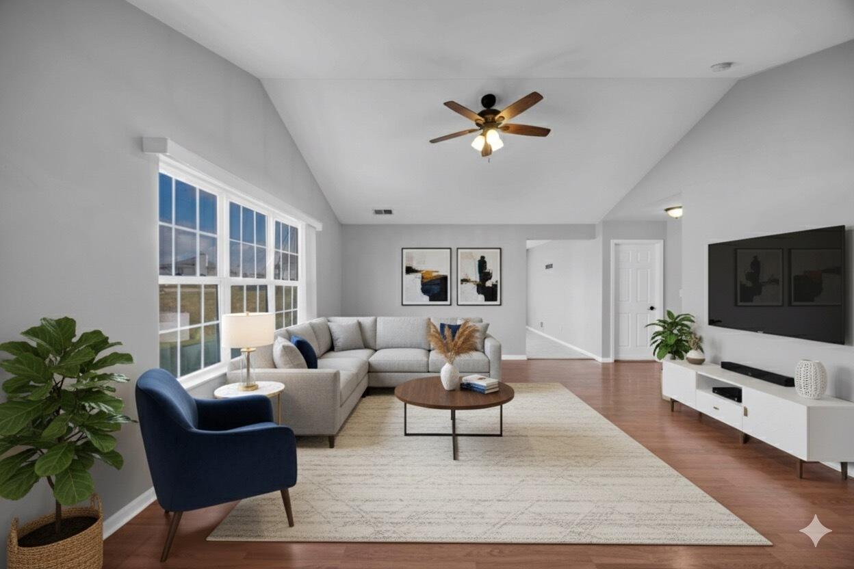 8461 Pierce Street Merrillville, IN 46410 - Photo 2 of 21 a living room with furniture and a flat screen tv