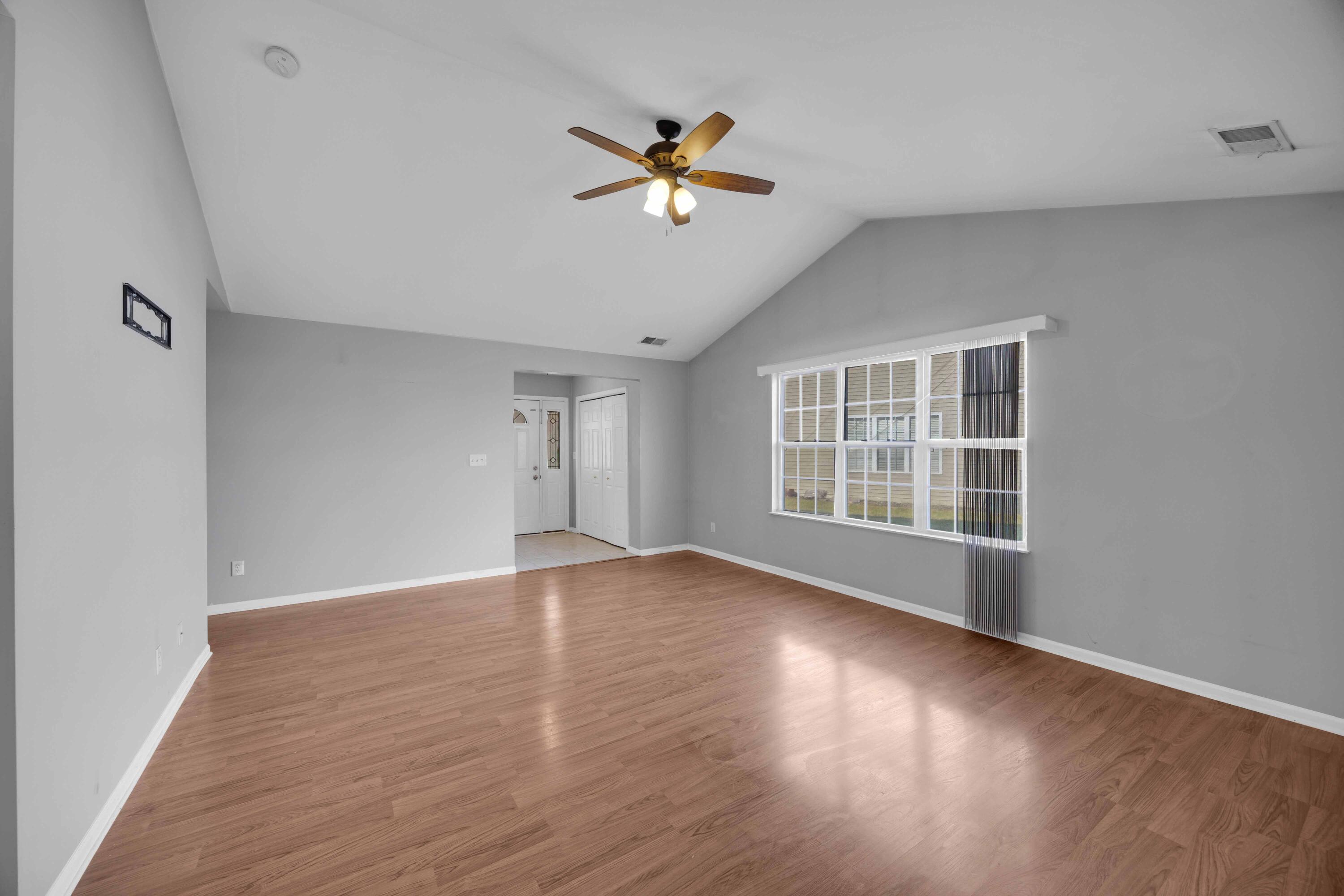 8461 Pierce Street Merrillville, IN 46410 - Photo 4 of 21 a view of an empty room with wooden floor and a window