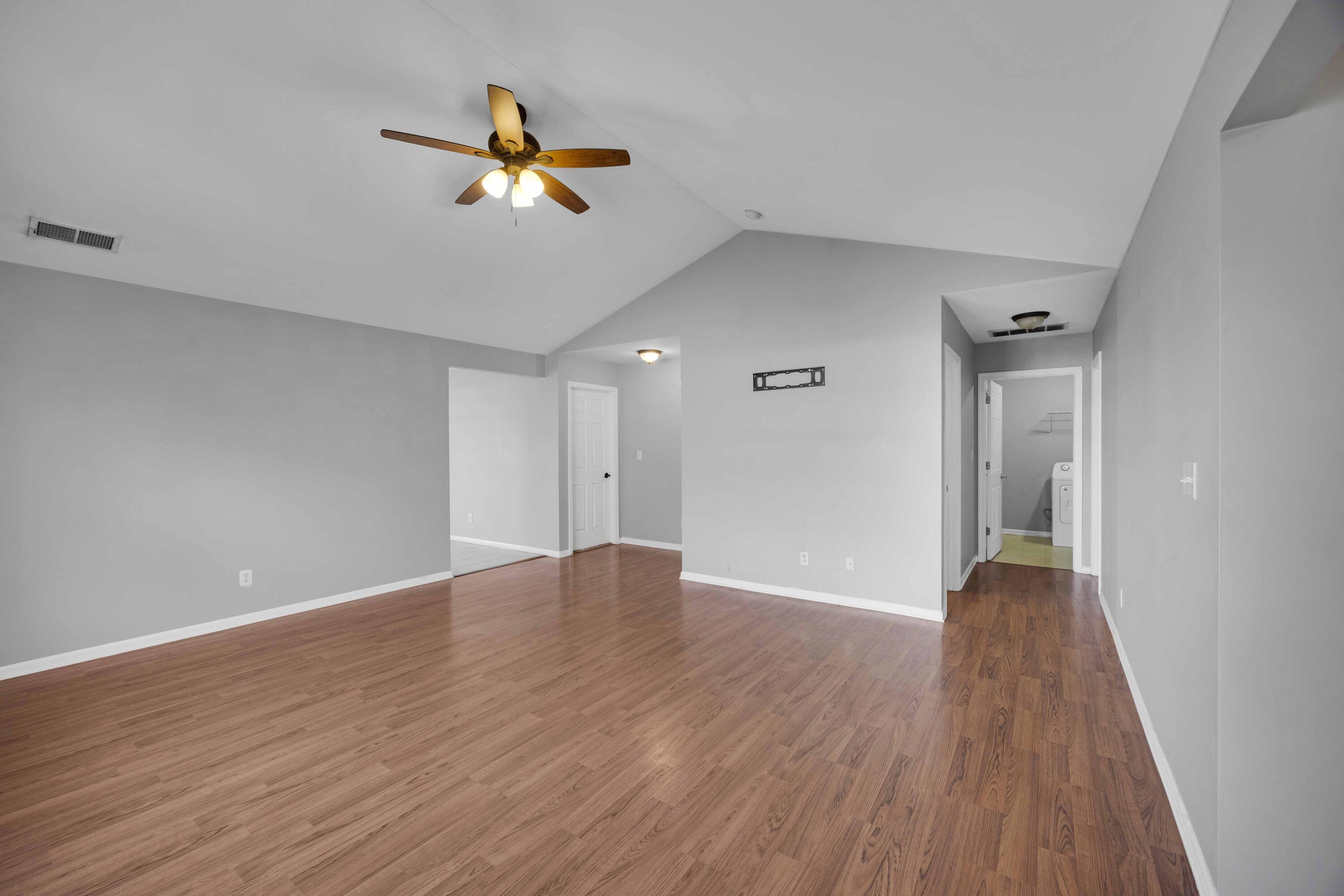 8461 Pierce Street Merrillville, IN 46410 - Photo 5 of 21 a view of empty room with wooden floor and fan
