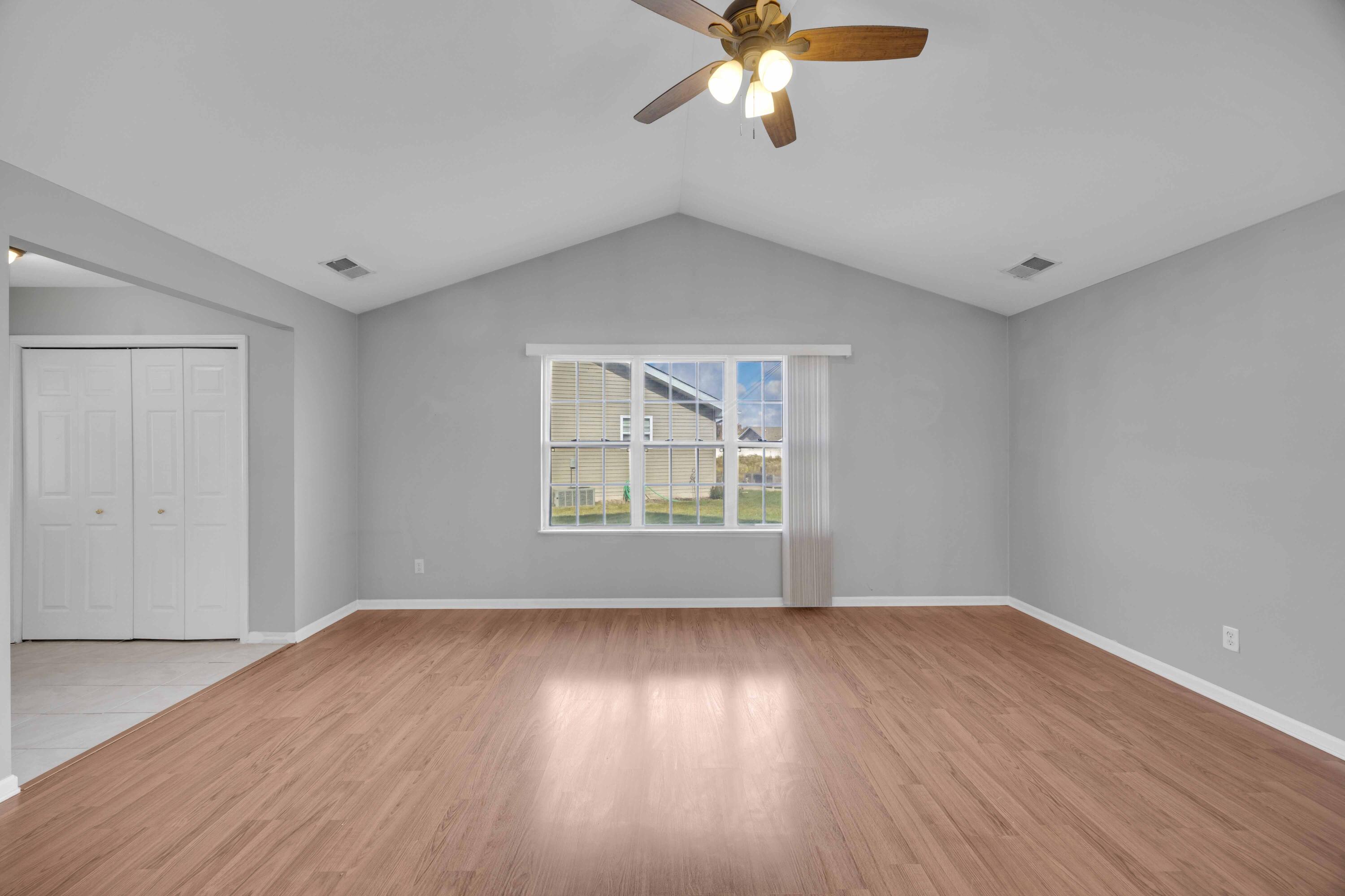 8461 Pierce Street Merrillville, IN 46410 - Photo 6 of 21 a view of an empty room with wooden floor and a window