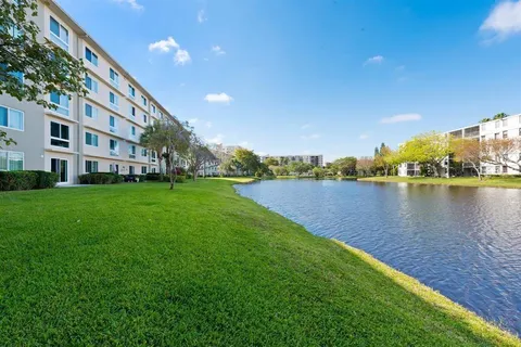 a view of a lake with houses in the back