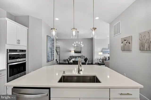 a bathroom with double vanity sink and a mirror
