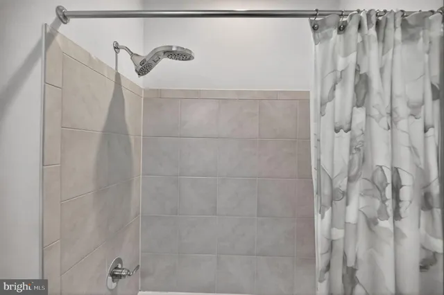 a balcony with furniture and a potted plant