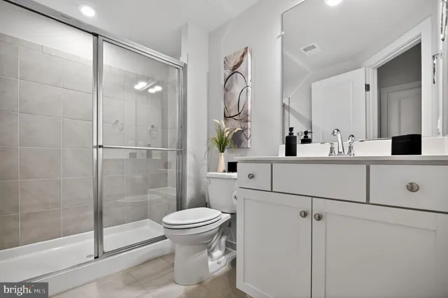 a room with furniture a large window and wooden floor