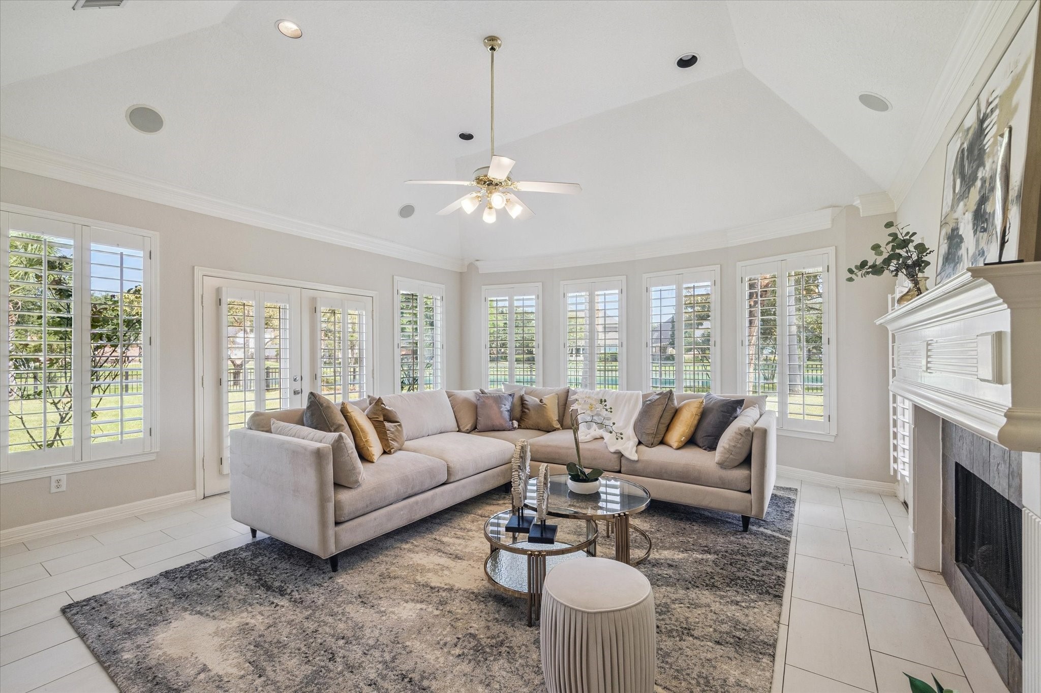 22522 Rippling Shore Court Katy, TX 77494 - Photo 13 of 41 a living room with furniture a fireplace and a chandelier