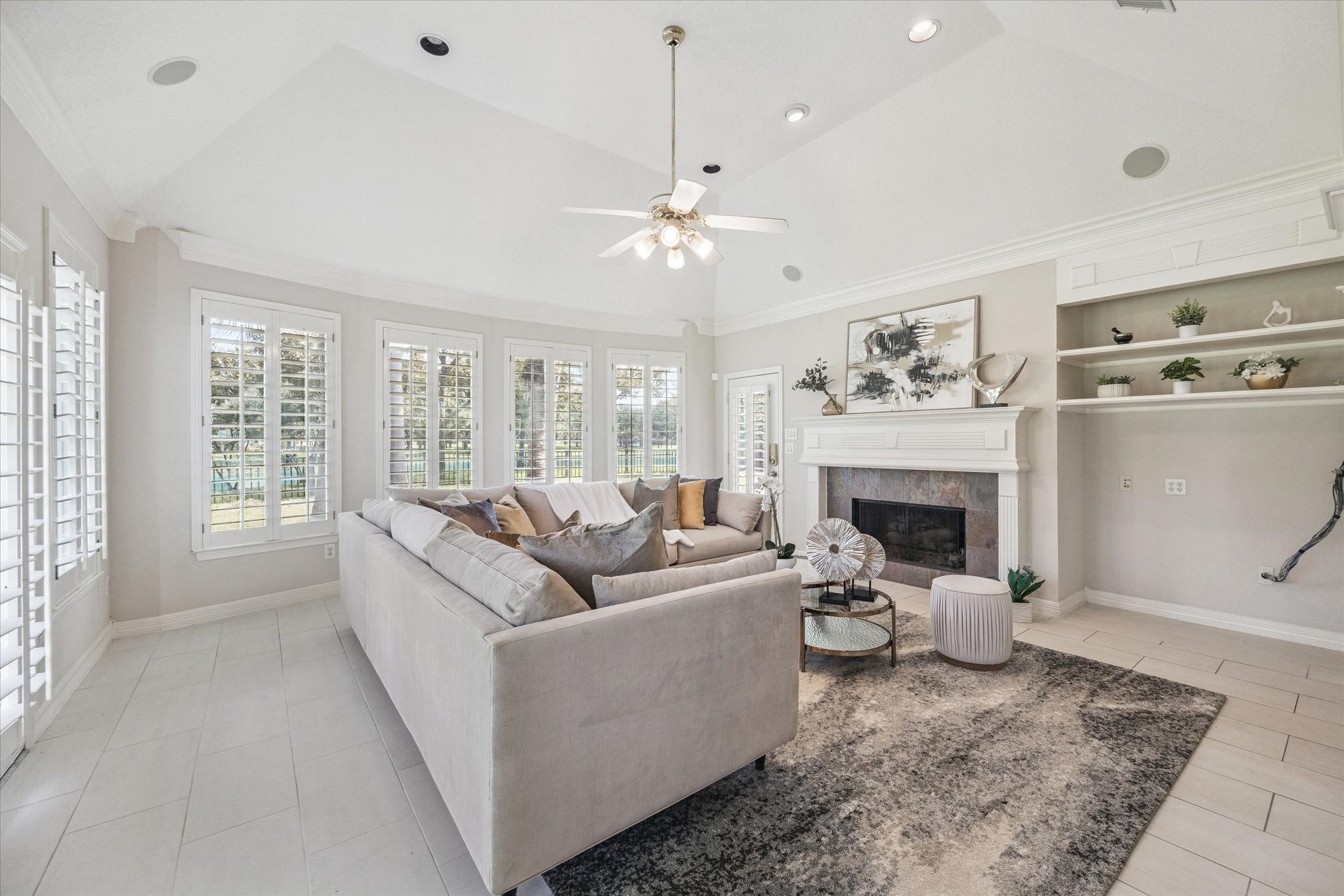 22522 Rippling Shore Court Katy, TX 77494 - Photo 14 of 41 a living room with furniture a window and a fireplace