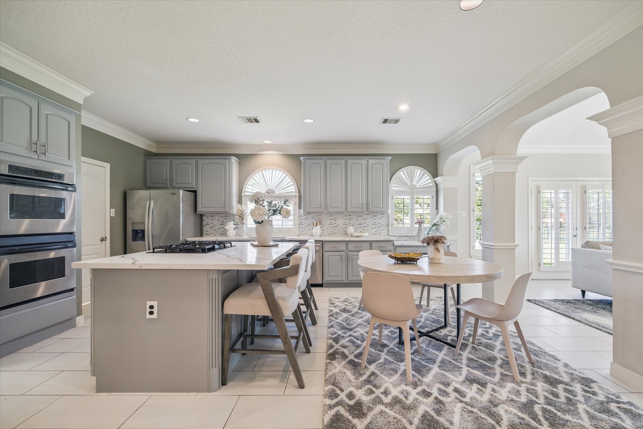 22522 Rippling Shore Court Katy, TX 77494 - Photo 17 of 41 a kitchen with a sink and chairs