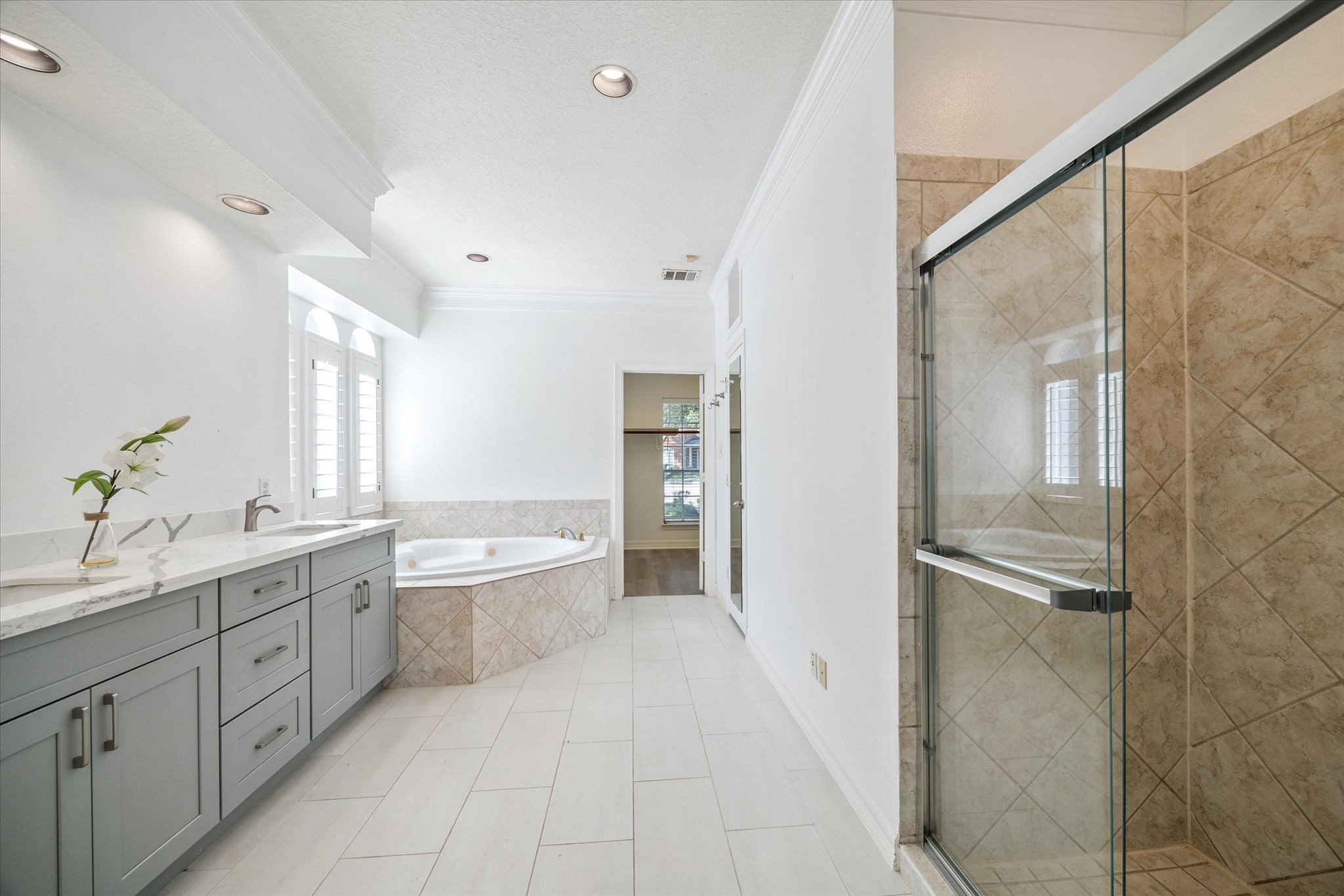 22522 Rippling Shore Court Katy, TX 77494 - Photo 25 of 41 a spacious bathroom with a granite countertop sink a toilet a mirror and shower