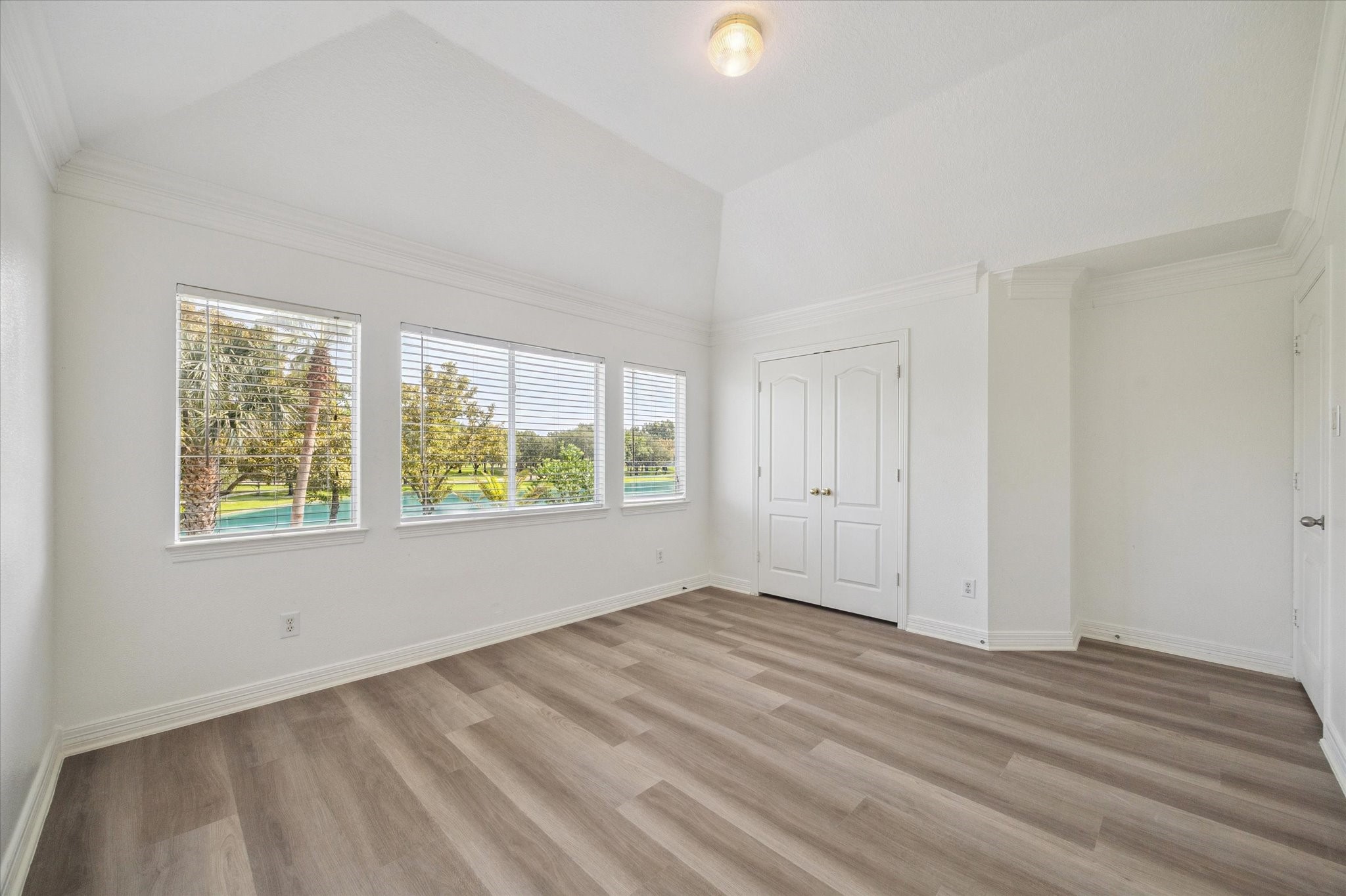 22522 Rippling Shore Court Katy, TX 77494 - Photo 30 of 41 a view of an empty room with wooden floor and a window