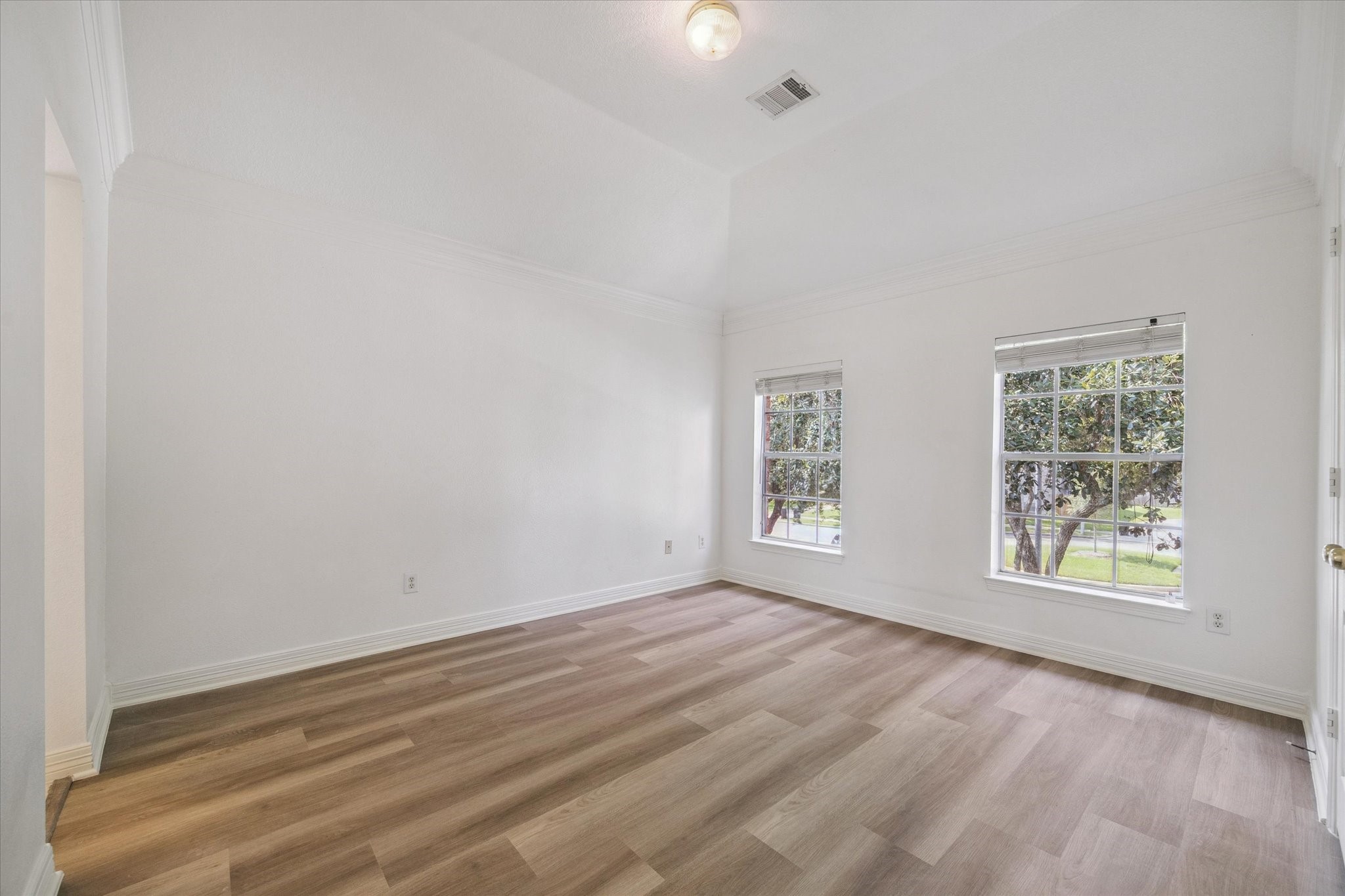 22522 Rippling Shore Court Katy, TX 77494 - Photo 32 of 41 an empty room with wooden floor and windows
