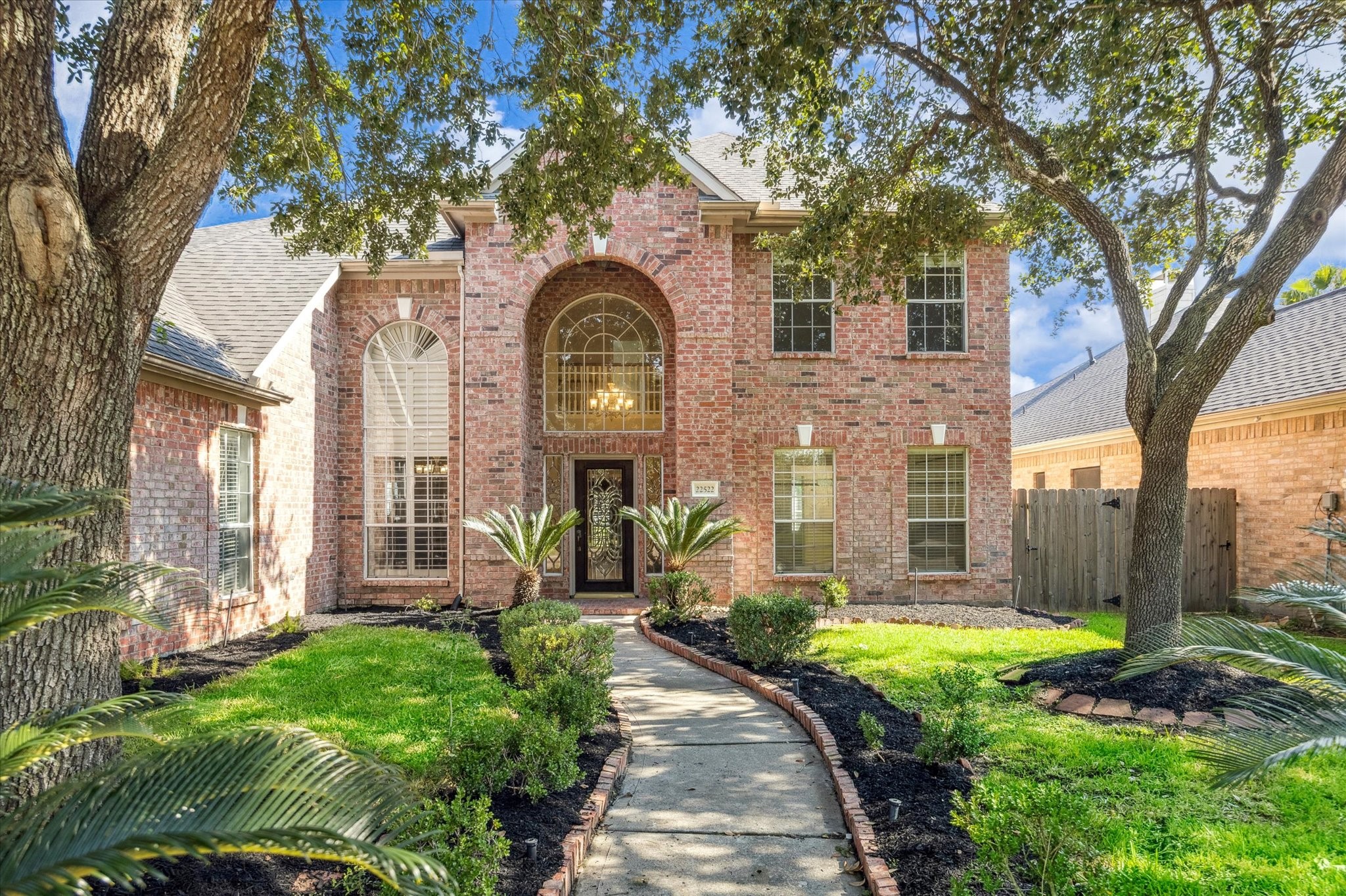 22522 Rippling Shore Court Katy, TX 77494 - Photo 6 of 41 a front view of a house with garden