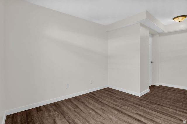 1836 West 800 North Mapleton, UT 84663 - Photo 17 of 38 Unfurnished room featuring baseboards and dark wood finished floors