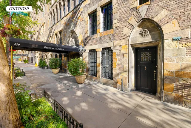 a view of a brick building with many windows